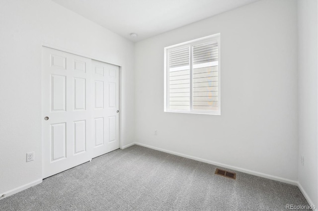 1242 Penner Dr, Erie, CO 80026 - unfurnished bedroom featuring baseboards, visible vents, a closet, and carpet floors