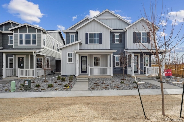 1242 Penner Dr, Erie, CO 80026 - view of front of property with covered porch and board and batten siding