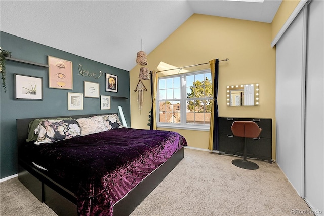 bedroom with baseboards, carpet flooring, and vaulted ceiling
