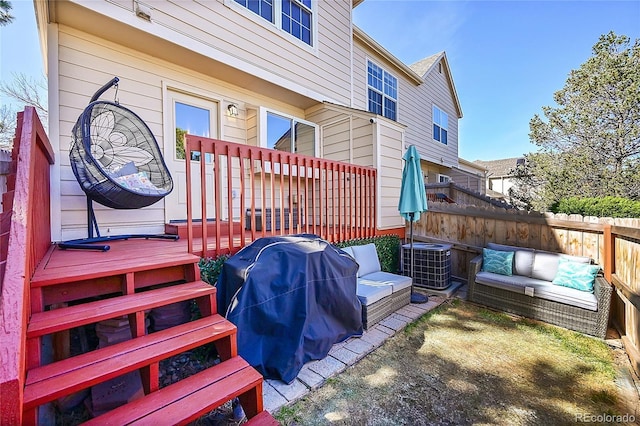 wooden deck with fence, an outdoor hangout area, and cooling unit