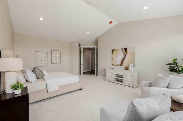 bedroom featuring vaulted ceiling and light carpet