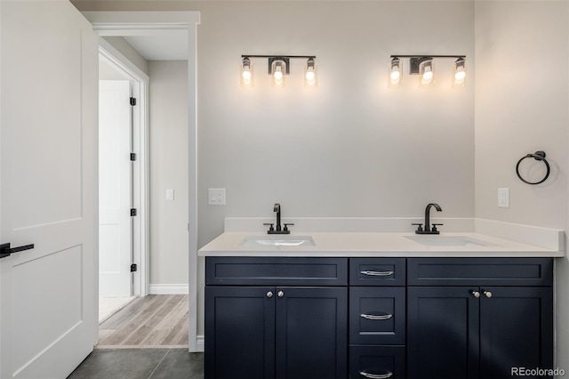 bathroom with vanity and hardwood / wood-style floors