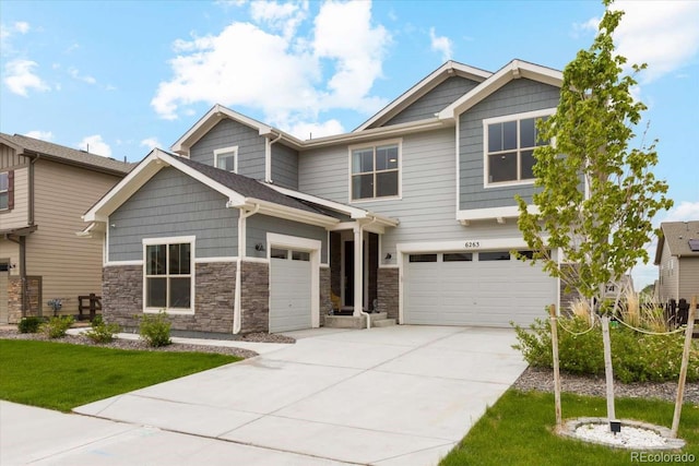 craftsman inspired home featuring driveway, a garage, stone siding, and a front lawn