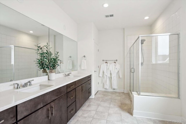 bathroom with a stall shower, recessed lighting, double vanity, tile patterned flooring, and baseboards
