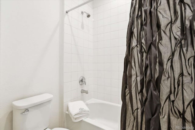 full bathroom featuring shower / bath combination with curtain and toilet
