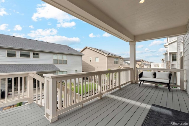 wooden deck with a residential view