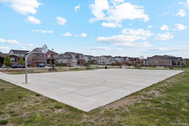 view of sport court with a residential view and community basketball court
