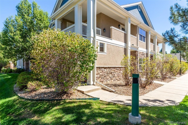 view of home's exterior with a lawn