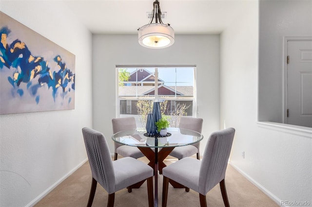 dining area with light carpet