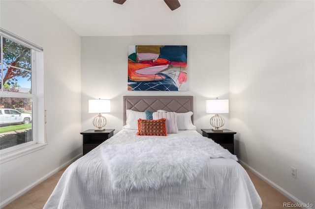 carpeted bedroom with ceiling fan