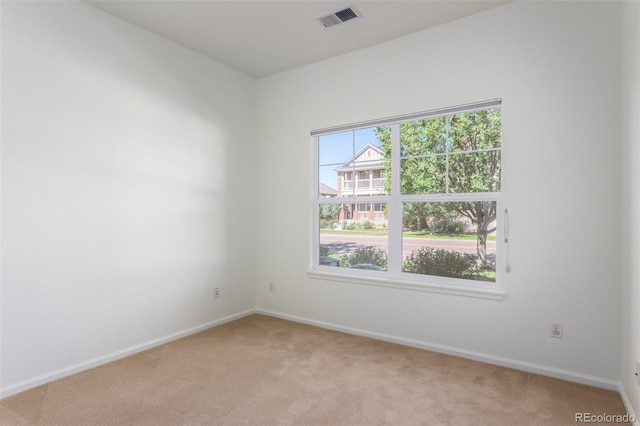 unfurnished room with light colored carpet