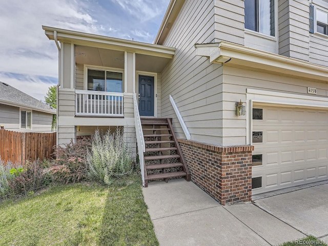 view of exterior entry with a garage