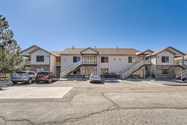 18084 Becket Dr, Parker, CO 80134 - view of front of property with stairway and stone siding