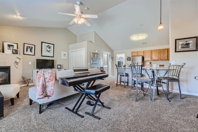 18084 Becket Dr, Parker, CO 80134 - living area with carpet flooring, ceiling fan, high vaulted ceiling, and a tiled fireplace