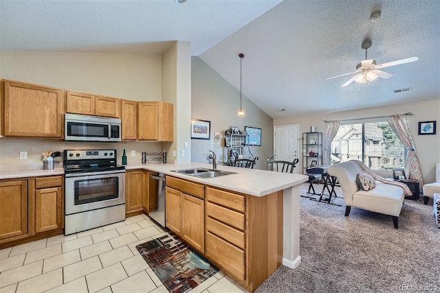 18084 Becket Dr, Parker, CO 80134 - kitchen featuring stainless steel appliances, a peninsula, light countertops, high vaulted ceiling, and ceiling fan