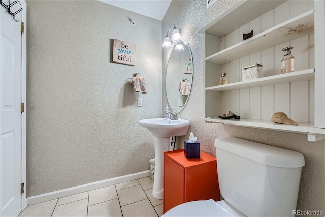 18084 Becket Dr, Parker, CO 80134 - half bathroom featuring tile patterned floors and a textured wall