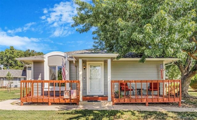 7887 York St Unit 1, Denver, CO 80229 - view of front facade featuring a deck