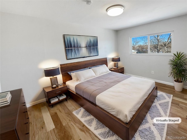 bedroom with light hardwood / wood-style flooring