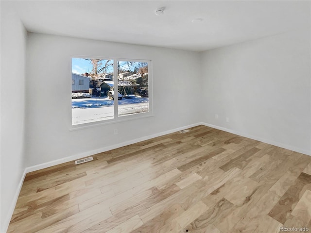 empty room with light wood-type flooring