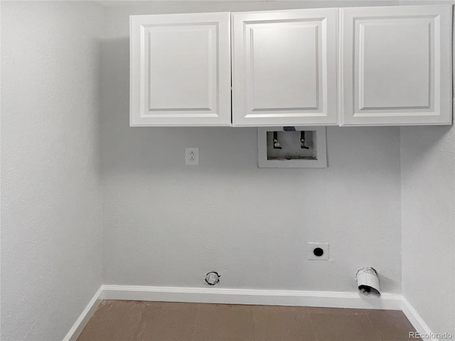 laundry area with tile patterned floors, electric dryer hookup, washer hookup, gas dryer hookup, and cabinets