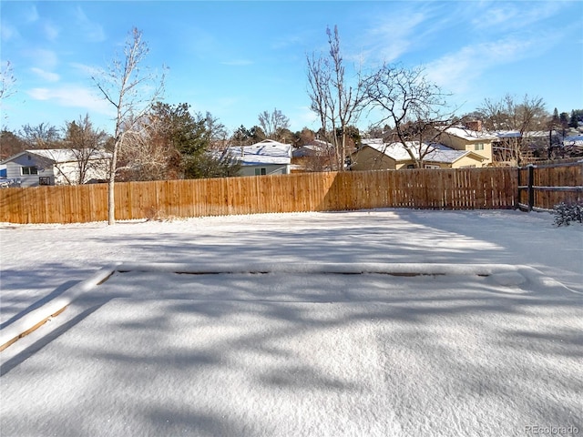 view of yard layered in snow