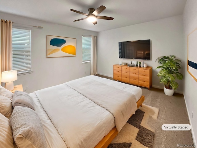 bedroom featuring baseboards and a ceiling fan