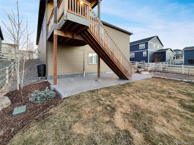 back of house featuring stairs, a patio, and fence