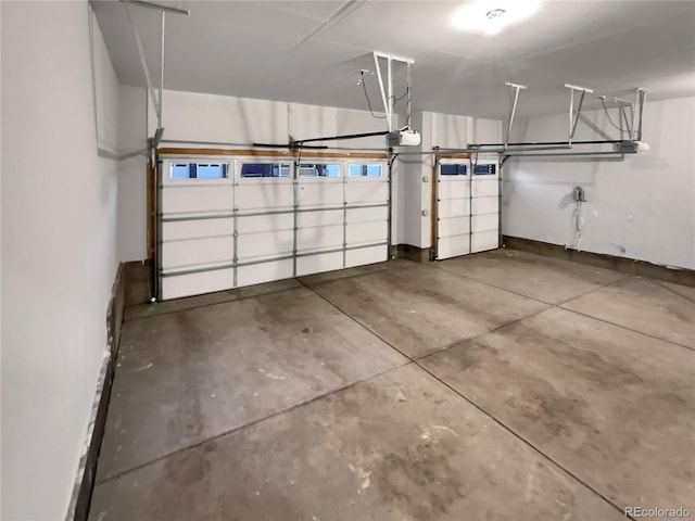 garage featuring baseboards and a garage door opener