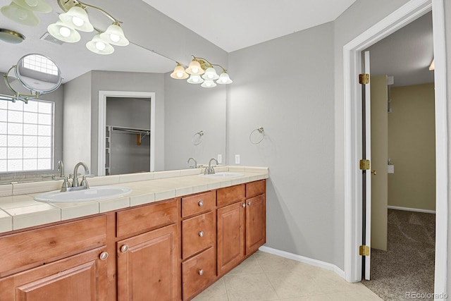 bathroom featuring tile patterned floors and vanity