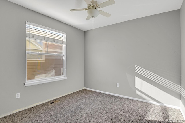 carpeted empty room with ceiling fan