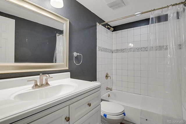 full bathroom with shower / tub combo with curtain, vanity, and toilet