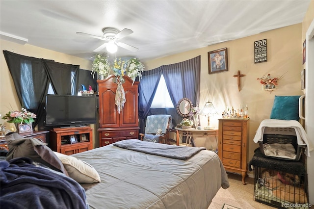 bedroom featuring ceiling fan and light colored carpet