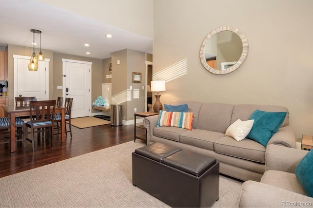 living room with baseboards, wood finished floors, and recessed lighting