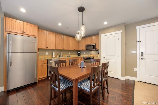 kitchen featuring light brown cabinets, appliances with stainless steel finishes, dark wood-type flooring, and recessed lighting