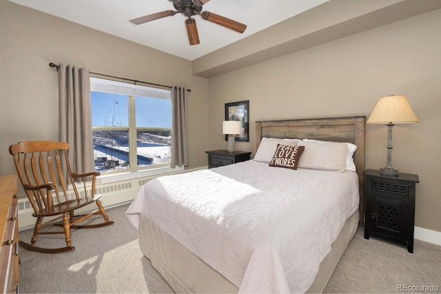 bedroom featuring baseboards and light colored carpet