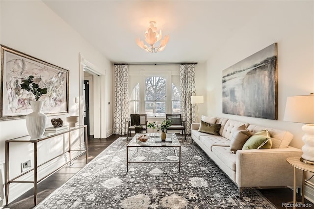 living room with baseboards and dark wood-style flooring