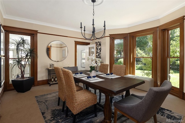 carpeted dining area with a notable chandelier and crown molding