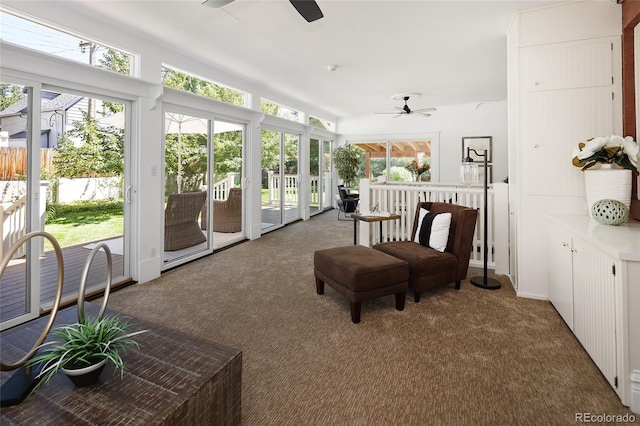 sunroom / solarium with ceiling fan and plenty of natural light