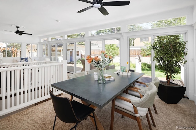 sunroom / solarium featuring ceiling fan