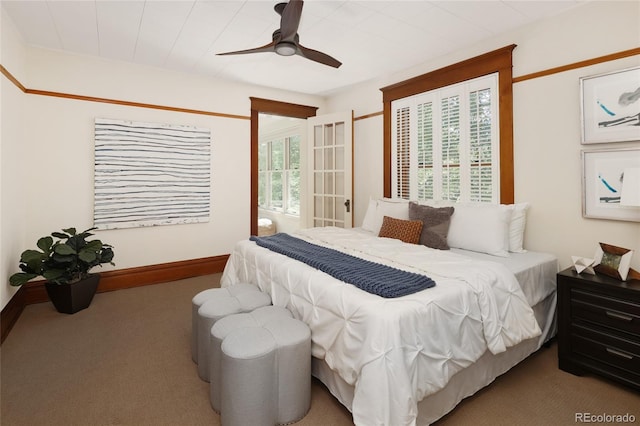 bedroom with multiple windows, carpet, and ceiling fan