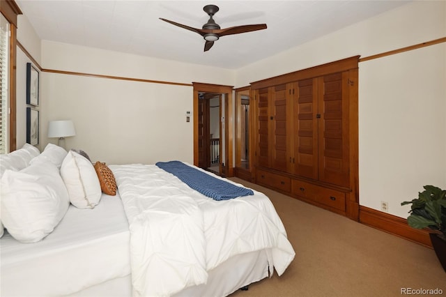 bedroom featuring ceiling fan and light colored carpet