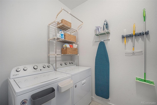 clothes washing area with laundry area and washer and clothes dryer