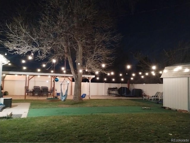 view of community featuring a storage unit and a patio area