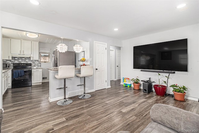 living room featuring dark hardwood / wood-style floors