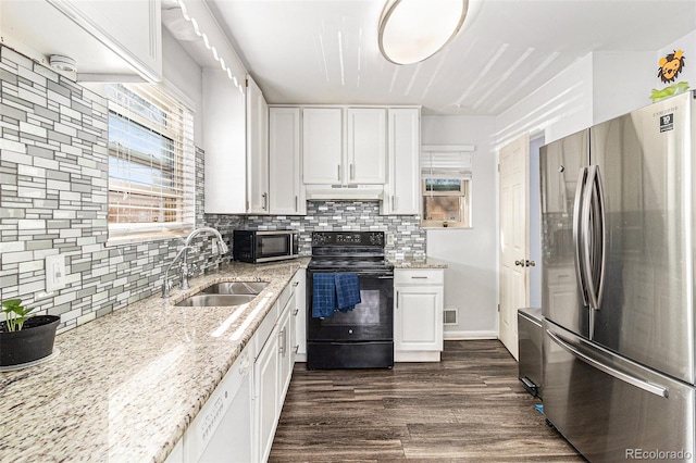 kitchen featuring light stone counters, stainless steel appliances, dark wood-type flooring, sink, and white cabinets