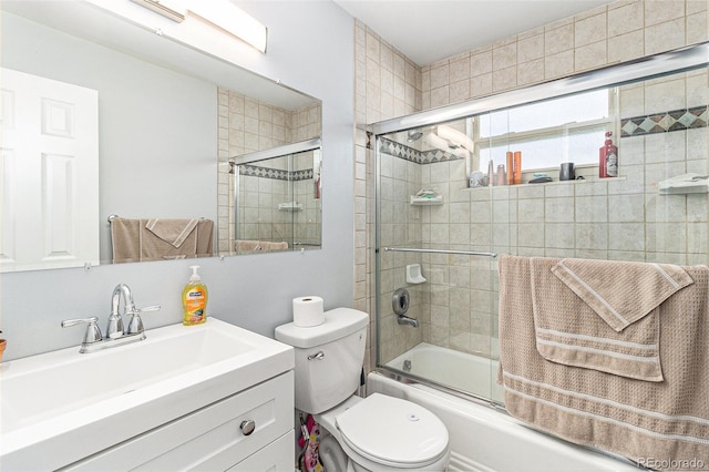 full bathroom with toilet, vanity, and combined bath / shower with glass door