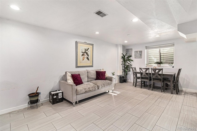 living room featuring a textured ceiling