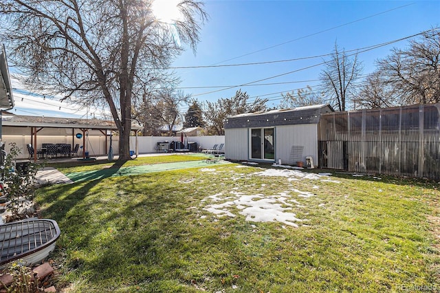 view of yard with a storage unit