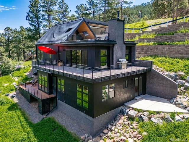 365 Bow Mountain Rd, Boulder, CO 80302 - rear view of property featuring a balcony and a chimney