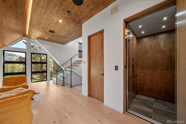 365 Bow Mountain Rd, Boulder, CO 80302 - corridor with elevator, wood ceiling, light wood finished floors, stairway, and recessed lighting